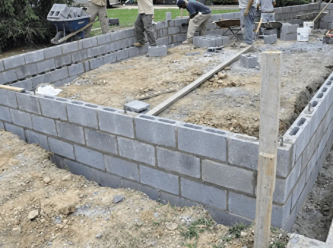 Professionals building a foundation with blocks in Baton Rouge, LA