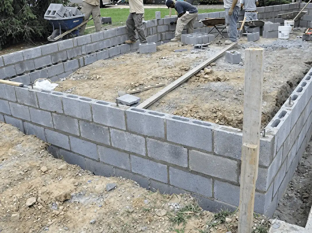 Professionals building a foundation with blocks in Baton Rouge, LA