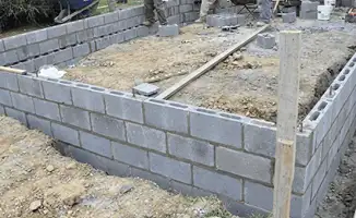 Professionals building a foundation with blocks in Baton Rouge, LA