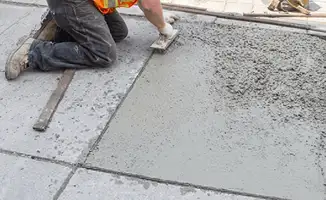 Professional repairing a concrete floor in Baton Rouge, LA