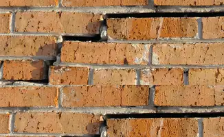 Brick wall with serious structural damage in Baton Rouge, LA